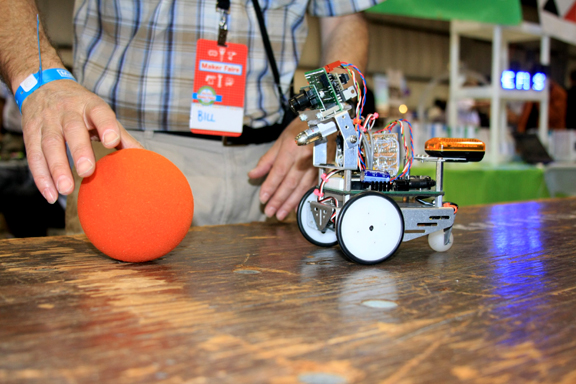 An automomous robot, programmed to follow the yellow ball (image courtesy of Tanya Vlach).